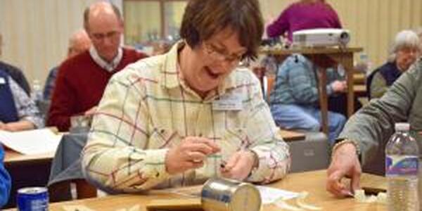 lady working on bee hotel project